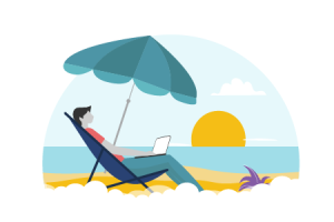 A guy working in his laptop on a beach